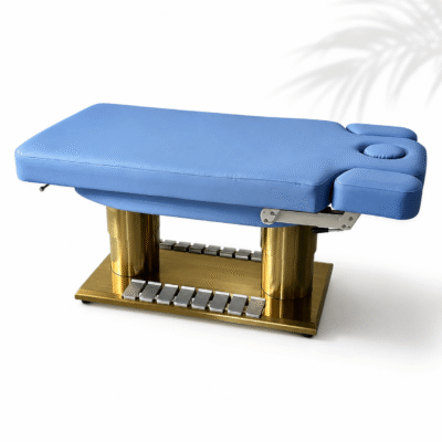 Heating Treatment Table with blue cushioning and gold electric base