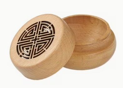 Wooden essential oil diffuser with decorative carved lid
