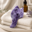 Purple Fish Tail Gua Sha displayed in a premium spa setting