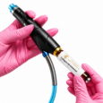 Booster Handle held with a skincare serum vial during facial treatment preparation