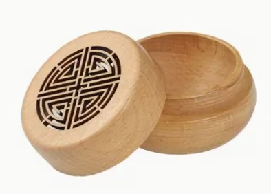 Wooden essential oil diffuser with decorative carved lid